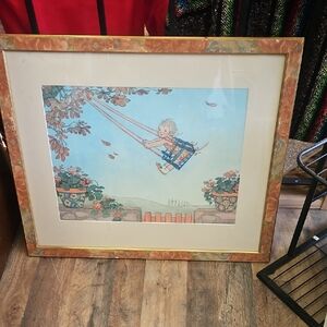 Framed Art Print with Child on Swing By HENRIETTA WILLEBEEK